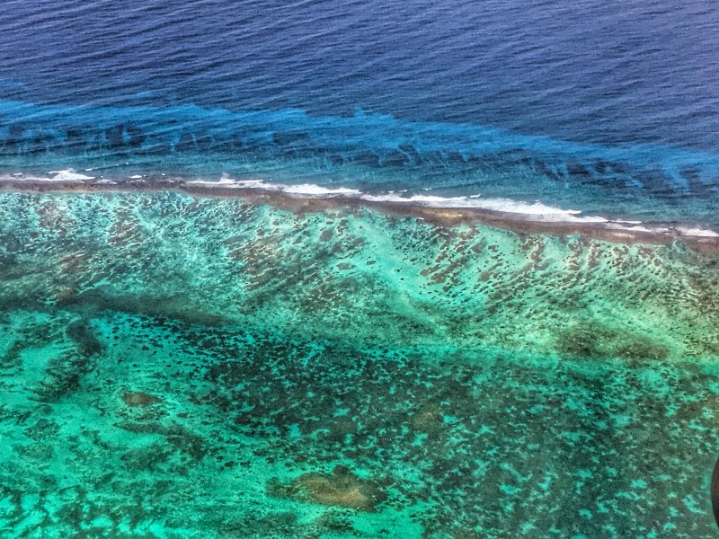 Aerial view of a coral reef through shallow water (Copyright: Amanda Gregory, JNCC)