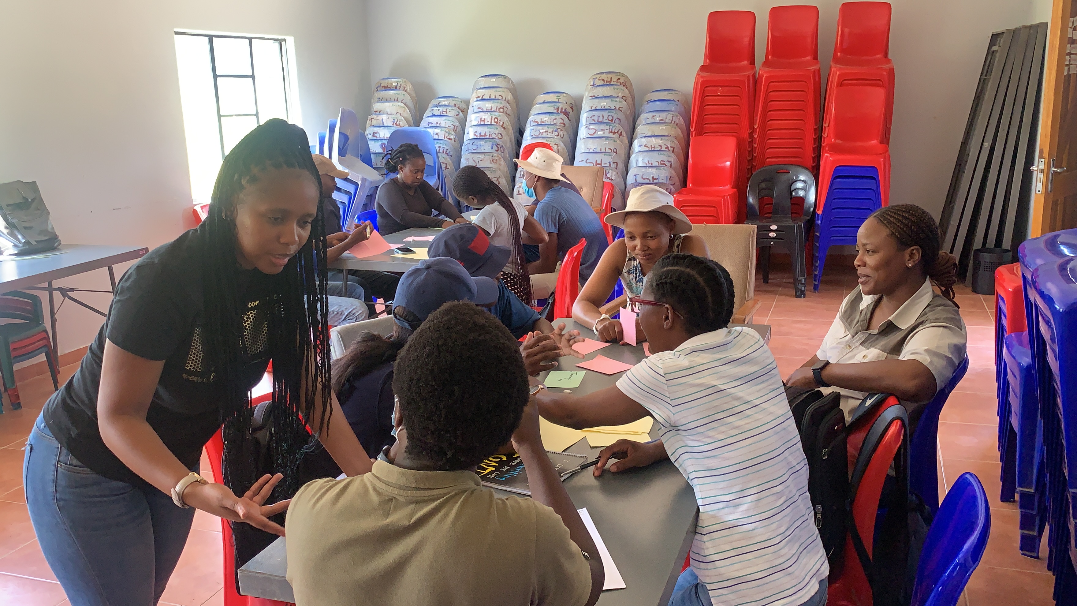 Photo of people sat at tables talking 