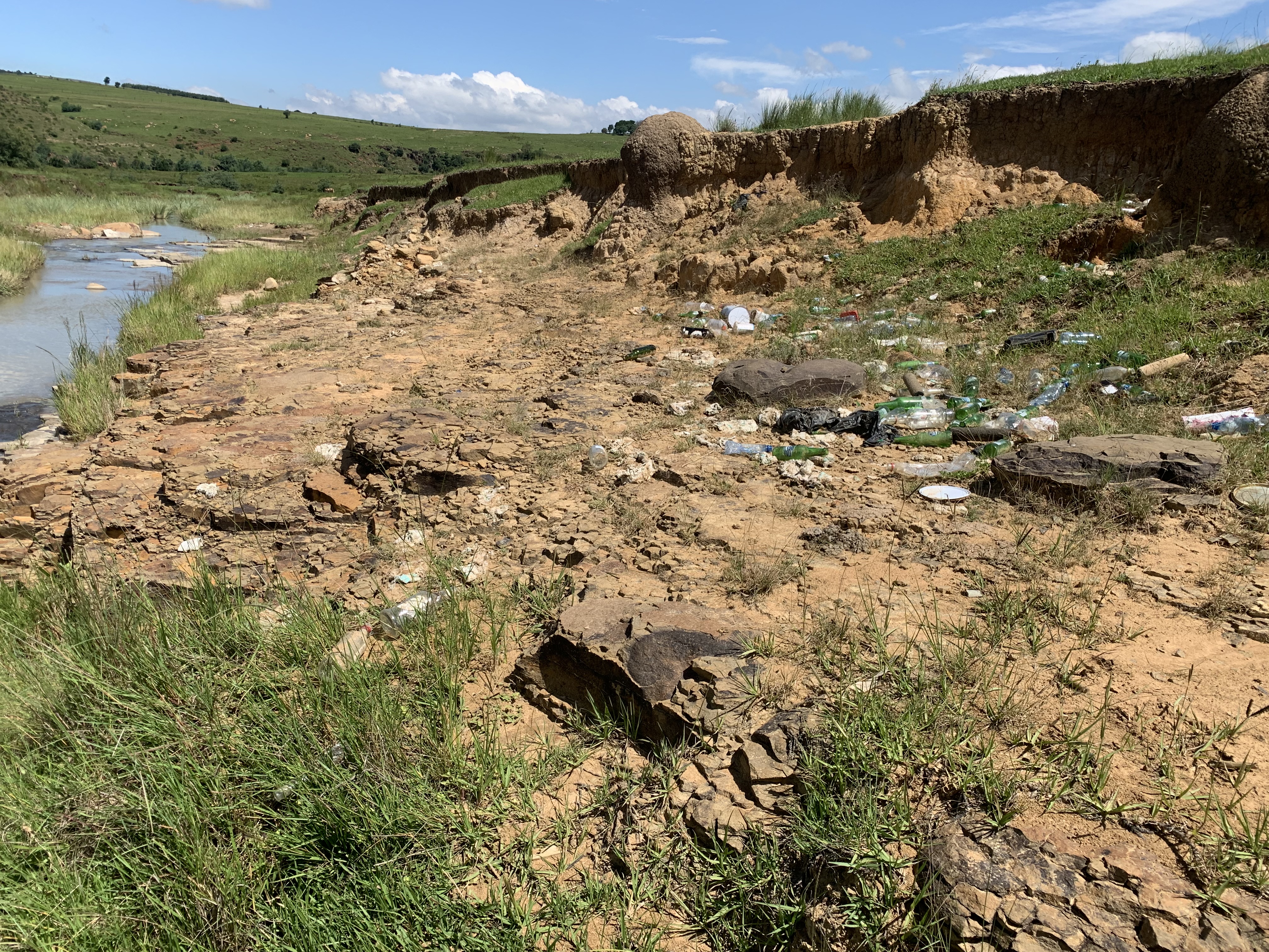 Rubbish littered on river bank