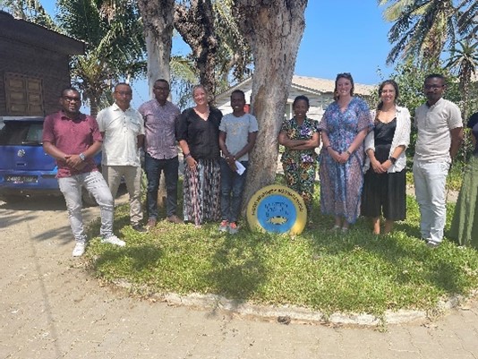 Image of group posing outside